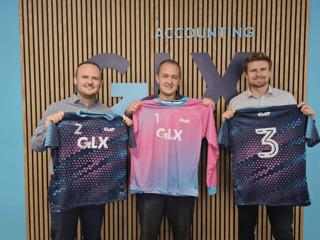 A few members of the GLX team with branded football kits